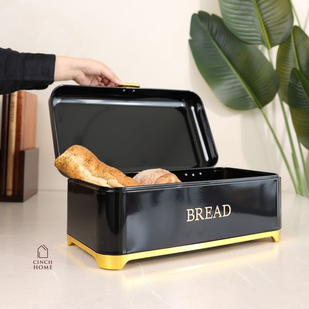 black bread box, bread storage container, bread box with lid, kitchen bread storage, bread bin for kitchen, black bread bin, bread storage box, premium bread box, luxury kitchen accessories, black and gold bread box, kitchen countertop organizer, bread keeper, bakery storage container, bread loaf holder, kitchen storage box, modern kitchen decor, countertop bread bin, food storage container, bread organizer, kitchen organization, housewarming gift, Diwali gift, Cinch Home Copy keywords