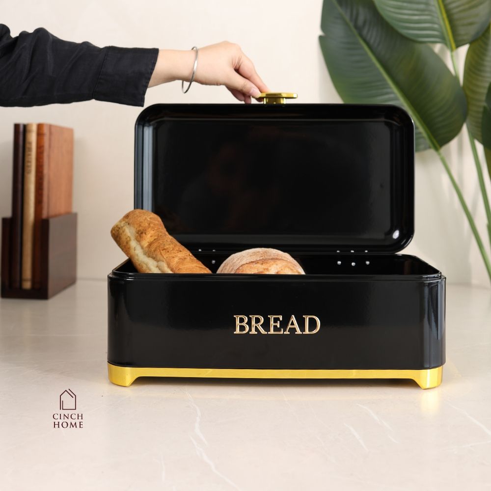 black bread box, bread storage container, bread box with lid, kitchen bread storage, bread bin for kitchen, black bread bin, bread storage box, premium bread box, luxury kitchen accessories, black and gold bread box, kitchen countertop organizer, bread keeper, bakery storage container, bread loaf holder, kitchen storage box, modern kitchen decor, countertop bread bin, food storage container, bread organizer, kitchen organization, housewarming gift, Diwali gift, Cinch Home Copy keywords