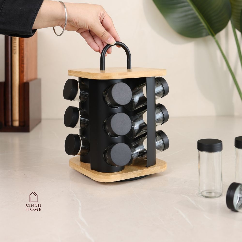 bamboo spice rack, rotating spice rack, spice rack with jars, 12 jar spice rack, glass spice jars, wooden spice rack, rotating masala rack, masala box organizer, kitchen spice organizer, spice jar set, spice storage rack, countertop spice rack, kitchen countertop organizer, stainless steel lid jars, Indian spice rack, masala storage containers, kitchen storage organizer, rotating kitchen organizer, herb and spice jars, pantry organizer, modern kitchen accessories, kitchen organization, Cinch Home Copy keywo