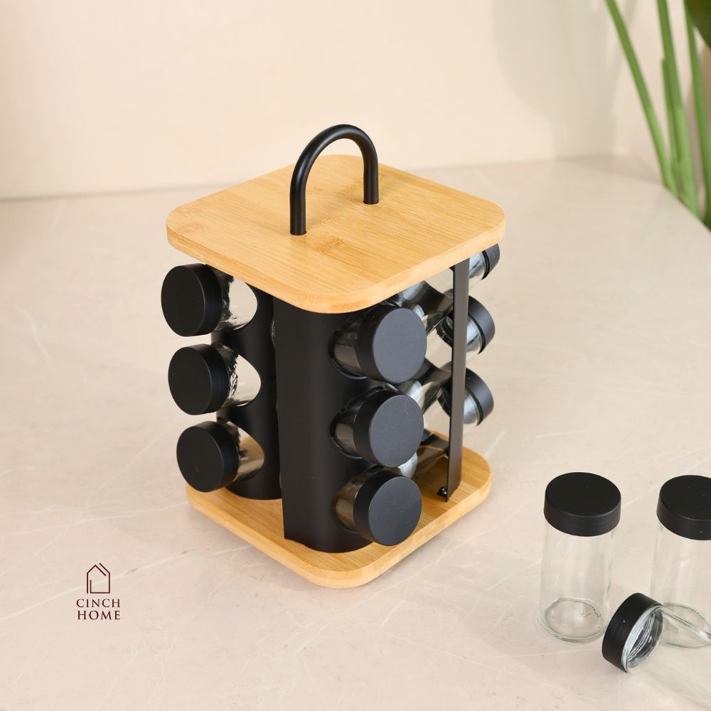 bamboo spice rack, rotating spice rack, spice rack with jars, 12 jar spice rack, glass spice jars, wooden spice rack, rotating masala rack, masala box organizer, kitchen spice organizer, spice jar set, spice storage rack, countertop spice rack, kitchen countertop organizer, stainless steel lid jars, Indian spice rack, masala storage containers, kitchen storage organizer, rotating kitchen organizer, herb and spice jars, pantry organizer, modern kitchen accessories, kitchen organization, Cinch Home Copy keywo