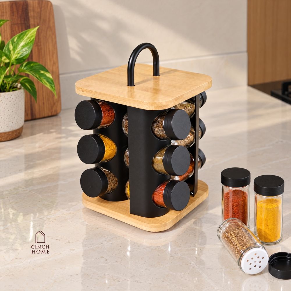 bamboo spice rack, rotating spice rack, spice rack with jars, 12 jar spice rack, glass spice jars, wooden spice rack, rotating masala rack, masala box organizer, kitchen spice organizer, spice jar set, spice storage rack, countertop spice rack, kitchen countertop organizer, stainless steel lid jars, Indian spice rack, masala storage containers, kitchen storage organizer, rotating kitchen organizer, herb and spice jars, pantry organizer, modern kitchen accessories, kitchen organization, Cinch Home Copy keywo