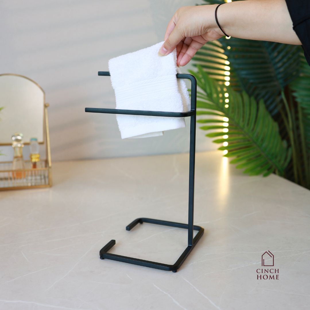 black towel stand for bathroom, modern hand towel holder, countertop towel rack, minimalist towel stand India, matte black towel holder, freestanding towel stand, bathroom accessories modern, small towel stand for sink, powder-coated towel rack, towel organizer for vanity.