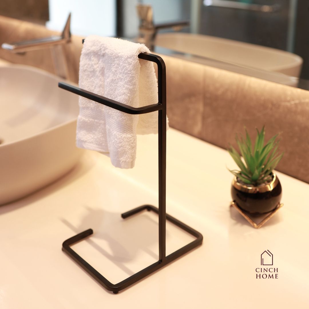 black towel stand for bathroom, modern hand towel holder, countertop towel rack, minimalist towel stand India, matte black towel holder, freestanding towel stand, bathroom accessories modern, small towel stand for sink, powder-coated towel rack, towel organizer for vanity.