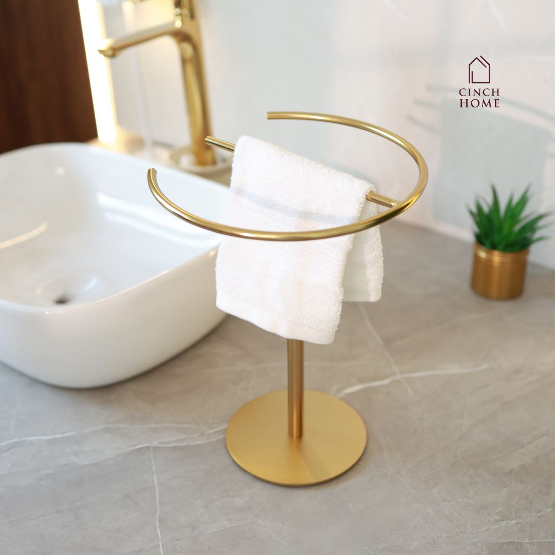 gold towel stand, countertop towel holder, knock-down towel rack, bathroom towel stand India, stainless steel towel holder, vanity towel rack, luxury bathroom accessories, gold hand towel holder, CinchHome towel stand, modern gold towel holder