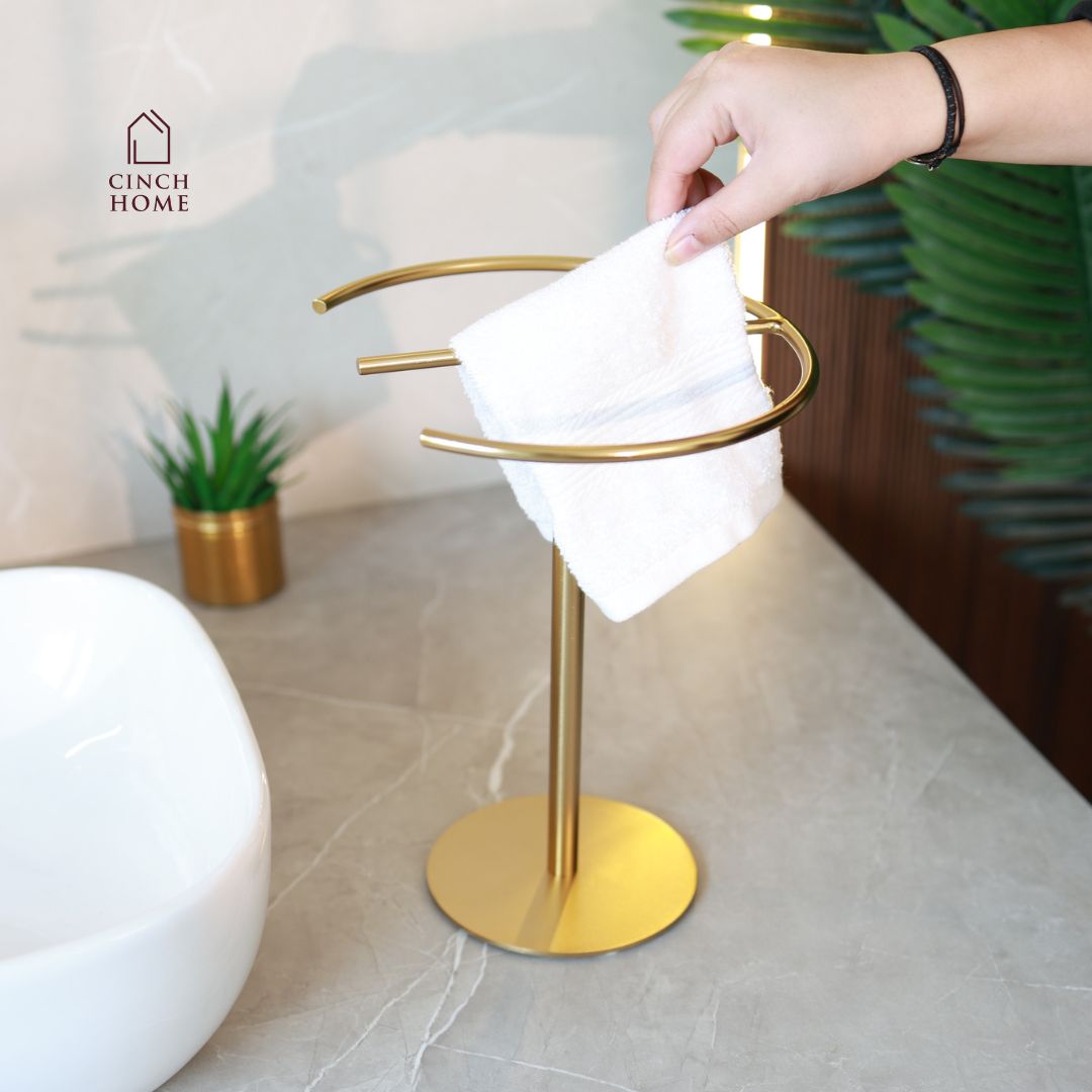 gold towel stand, countertop towel holder, knock-down towel rack, bathroom towel stand India, stainless steel towel holder, vanity towel rack, luxury bathroom accessories, gold hand towel holder, CinchHome towel stand, modern gold towel holder
