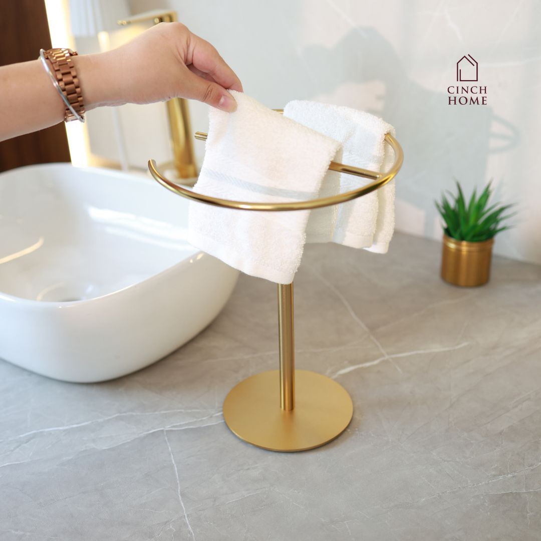 gold towel stand, countertop towel holder, knock-down towel rack, bathroom towel stand India, stainless steel towel holder, vanity towel rack, luxury bathroom accessories, gold hand towel holder, CinchHome towel stand, modern gold towel holder