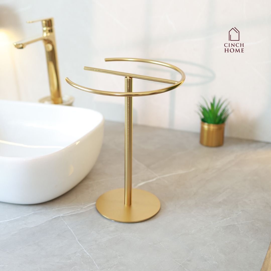 gold towel stand, countertop towel holder, knock-down towel rack, bathroom towel stand India, stainless steel towel holder, vanity towel rack, luxury bathroom accessories, gold hand towel holder, CinchHome towel stand, modern gold towel holder