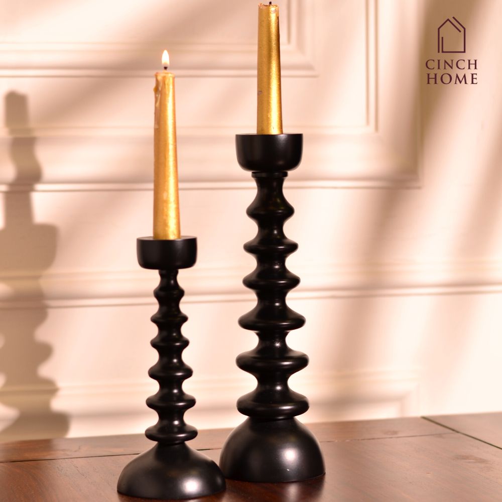 Candle Stands by Cinch Home bring to you metal candle stands, glass candle stands and wooden Candle Stands. This Diwali, light up your homes with our wide range of exquisite Candle holders at affordable prices. You can also buy scented Pillar Candles of different sizes. Premium Candle Holders and Luxury Candle Stands